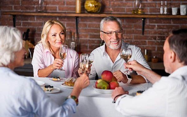 63077010 - calm and happy. middle-aged couple listening for toasting at table