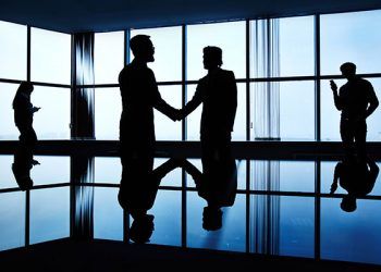 Silhouettes of business people in office