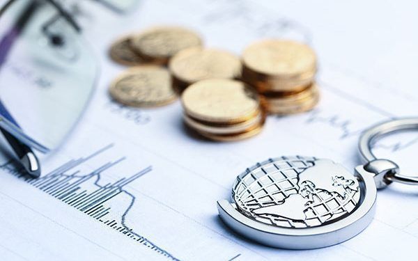 Coins, paper money and globe on white Statistic form background