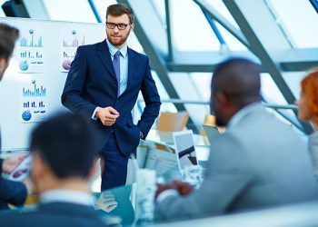 Young businessman making presentation to his colleagues