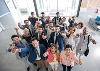 54231993 - portrait of thumb up smiling business people