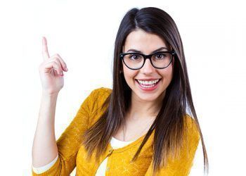 Portrait of pretty young woman with casual wear pointing up