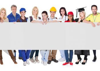 Group of diverse professionals presenting empty banner. Isolated on white