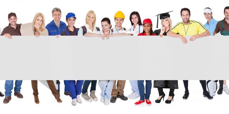 Group of diverse professionals presenting empty banner. Isolated on white