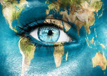 Planet earth and blue human eye - "Elements of this image furnished by NASA"
