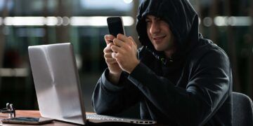 Hacker using a smartphone