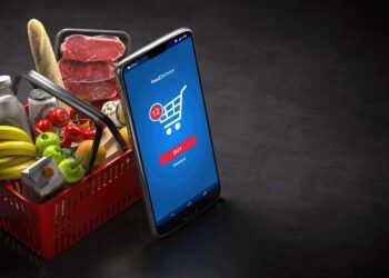 Shopping basket with fresh food and smartphone or mobile. Grocery supermarket, food and eats online buying and delivery concept. 3d illustration