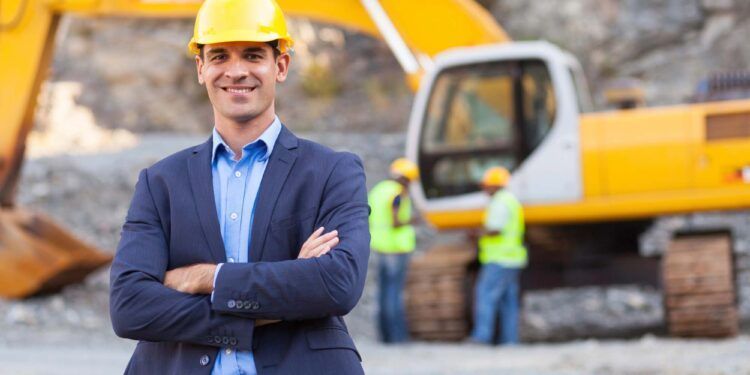 cheerful manager with arms crossed