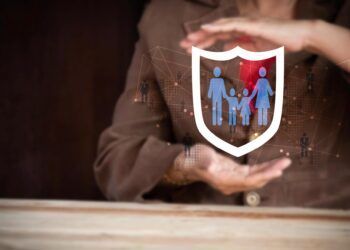 Businesswoman with protective gesture and family, life, health and house insurance icons. Insurance concept, Family life insurance and policy concepts.