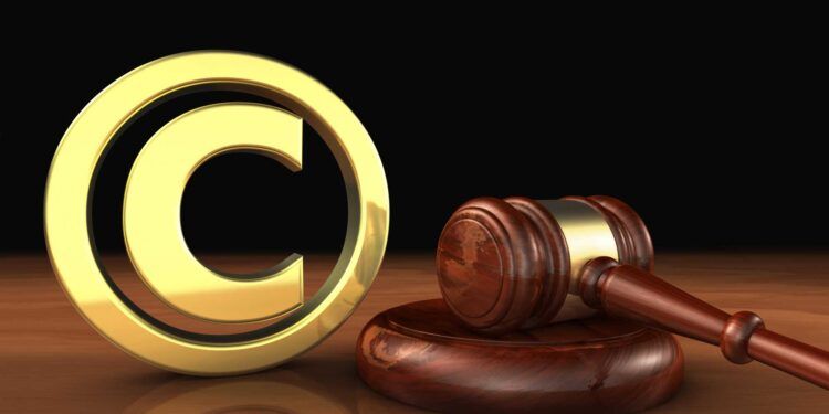 Copyright intellectual property and digital copyright laws conceptual illustration with symbol and icon and a gavel on black background.