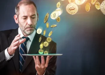 Bitcoin saliendo de una tablet